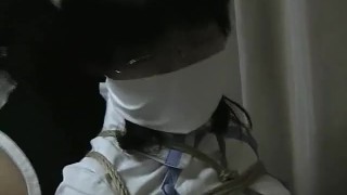 japanese cosplayers tied back to back