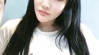 asian girlfriend gives bf a blowjob while she does her make-up