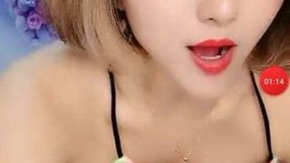 tattooed girl shows milk in live room