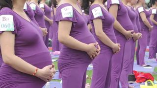 pregnant asian women doing yoga (non porn)