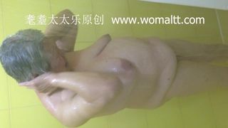 chinese hat granny taking a shower