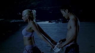 chinese man and white girl on the beach (2007)