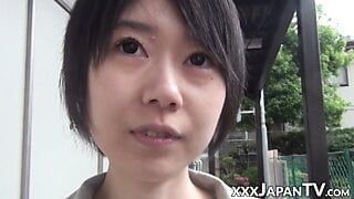 young japanese woman shows off butt and twat